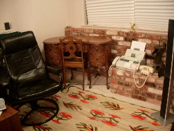 My mother's desk -- tucked away between a recliner and the fax machine.