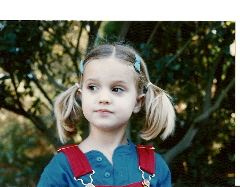 Christina in her brand-new dungarees, ready for preschool.