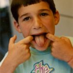 seven-year-old-boy-sticking-out-tongue 7-year-old-boy sticking out his tongue. Photo by BF Newhall.