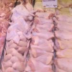 Chicken wings, legs and breasts in butcher's case. Photo by BF Newhall