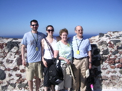 PHOTO FIVE. On the island of Santorini. The four of us and tons of tourists. And shops.