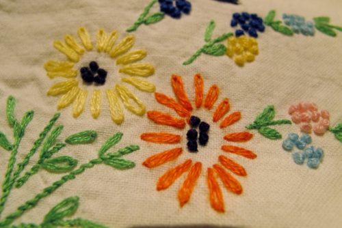 hand embroider pillowcase with french knots & daisies. Photo by BF Newhall.