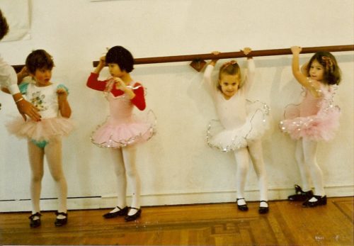 four pretty preschool girls in tutus at the ballet barre. Photo by Barbara Newhall