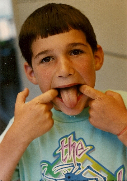 7-year-old-boy sticking out his yucky tongue. Photo by BF Newhall.