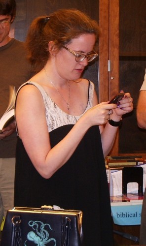 Memoirist Lauren Winner checking cell phone at The Glen, 2009. Photo by BF Newhall