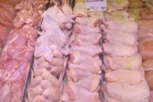 Chicken wings, legs and breasts in butcher's case. Photo by BF Newhall
