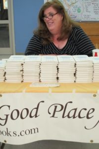 Kathleen Caldwell, proprietor of A Great Good Place for Books, selling Anne Lamott's book, "Help, Thanks, Wow." Photo by BF Newhall
