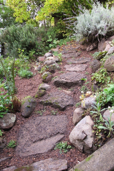 A lava rock steppingstone garden path. Photo by BF Newhall
