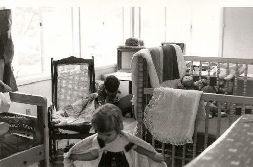 A 1986 home office with computers, crib, kids and cat. Photo by BF Newhall