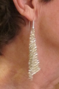 Woman wearing Swarovsky Fit Silver Shade earrings. Photo by BF Newhall
