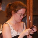 Author Lauren Winnerchecks her cell phone at The Glen in Santa Fe in 2009. Photo by BF Newhall