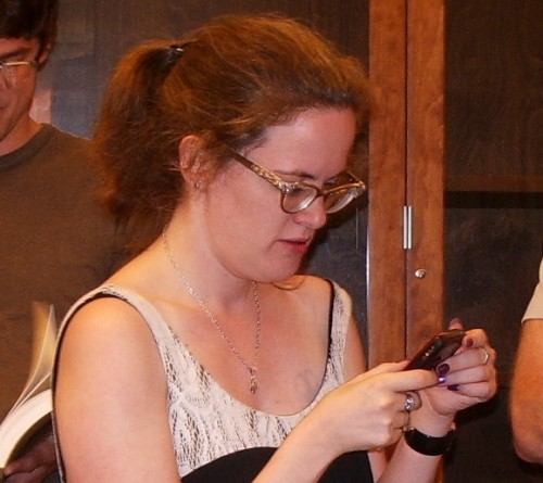 Author Lauren Winnerchecks her cell phone at The Glen in Santa Fe in 2009. Photo by BF Newhall
