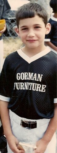 eight-year-old boy in Gorman Furniture Berkeley baseball league uniform. Photo by BF Newhall