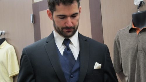 Bearded groom wearing purple necktie and vest with tux at Mens Wearhouse. Photo by BF Newhall