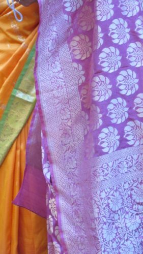 Part of an orange and green sari and a purple sari at an Indian wedding in the San Francisco Bay Area. Photo by BF Newhall