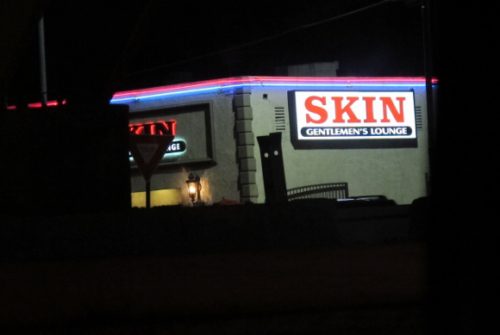 a sign in los angeles advertising "Skin, A Gentleman's Lounge." Photo by BF Newhall