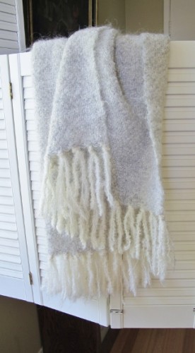 A white and cream wool shawl with long fringes handwoven by Mary Helen Blohm. Photo by BF Newhall