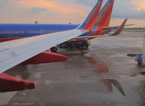 a southwest airline plane on a rainy tarmack. Photo by BF Newhall