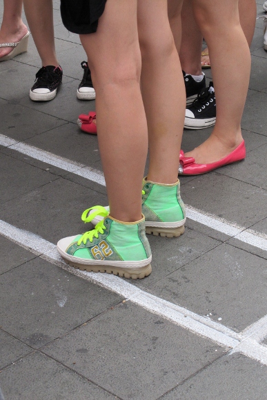 Bright blue-green high top sneakers on a bare-legged Shanghai girl. Photo by BF Newhall