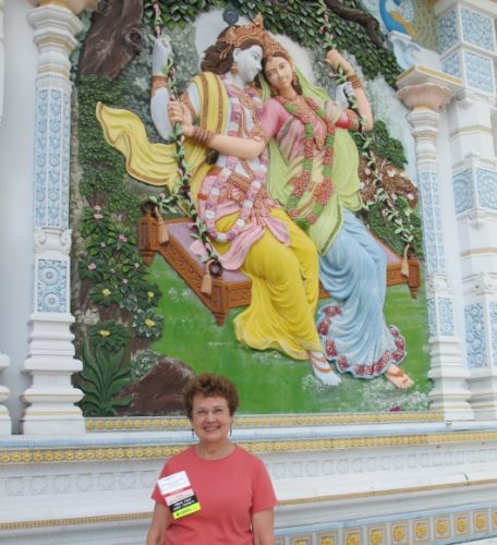 Writer Barbara Falconer Newhall visits the Radha Madhav Dham temple in Austin, TX, and a portrait of Krishna and his consort. Photo by Don Lattin
