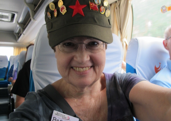 Writer Barbara Falconer Newhall wears a khaki Mao hat with numerous Mao buttons in Beijing. Photo by BF Newhall