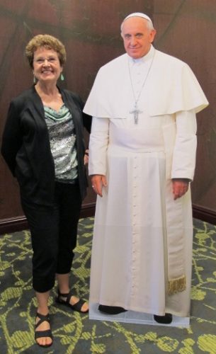 Writer Barbara Falconer Newhall poses with a mock-up of Pope Francis at the Religion Newswriters Association conference in Austtin, 2013. RNA photo