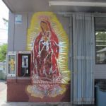 a mural of guadalupe is painted on the wall of a check cashing establishment in east Austin TX. photo by bf newall