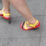 red-soled plastic sandals with black and yellow straps on the streets of Shanghai. photo by BF Newhall