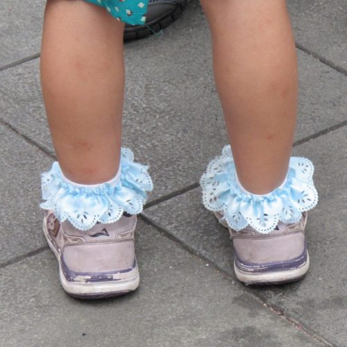 A Chinese toddler's pink sneakers and powder blue ruffled socks in Shanghai. Photo by BF Newhall