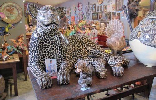 Interior of Galeria Atotonilco, San Miguel de Allende, Mexico, with hand-painted figurines of jaguars. Photo by BF Newhall