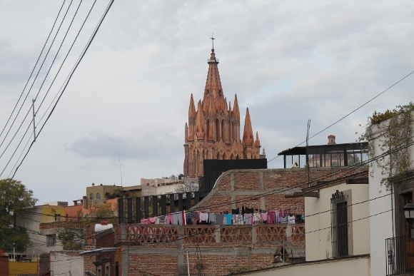tower and steeple of parroquia of san miguel de allende, mexico, with view of city in foreground. Photo by BF Newhall