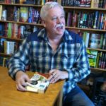Armistead Maupin signs his book, "The Days of Ana Madrigal," at Book Passage, SF Ferry Building. Photo by BF Newhall