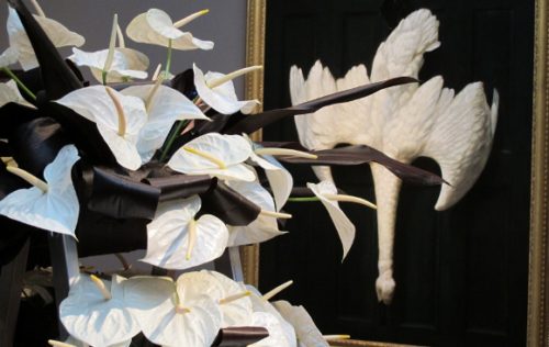 Rhonda Stoffel created a bouquet of white anthuriums in response to  Alexander Pope's black and white painting of dead swan. Photo by BF Newhall