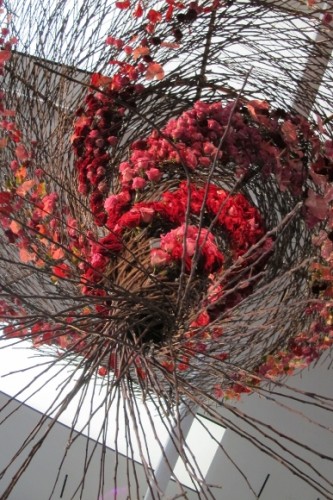 From Waterlily Pond Floral Design Studio, San Francisco, an aeriel design of twigs and red blossoms. Photo by BF Newhall