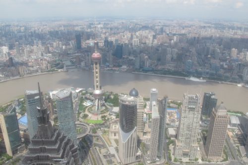 An aerial view of Shanghai and Pudong from a skyscraper in Pudong showing mile after mile of highrises. Photo by BF Newhall