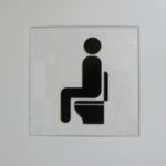 A symbol in the lavatory of Shanghai airport indicating a Western-style sit-down toilet. Photo by BF Newhall