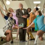 robert morse in season finale of mad men tv show dances and sings the best things in life are free with four pretty secretaries.