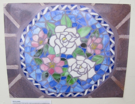 "White Roses" is a glass mosaic inset with pink and white flowers by Rachel Rodi. Photo by BF Newhall Photo by BF Newhall