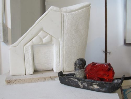 Left: Patricia Bengtson-Jones' sculpture "Arcades." Carrara marble, limestone base. Right: "Gnome with Curls on a Voyage." Iron, cast glass. Photo by Barbara Falconer Newhall.