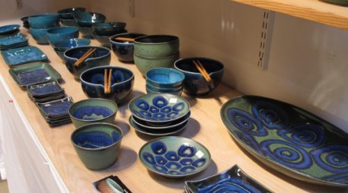 A shelf of Itsuko Zenitani's fine porcelain ceramic blue tableware on display at the Berkeley Potters Guild. Photo by BF Newhall 