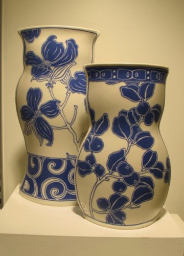Sarah Gregory ceramics, at Potters Guild, Berkeley, CA. Two white vases w blue floral painting by Sarah Gregory ceramics, at Berkeley Potters Guild, CA. . Photo by BF Newhall
