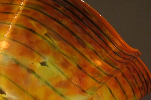Detail of prange and green striped vessel from "Machia Forest" display at the Chihuly Garden and Glass museum, Seattle. Photo by Barbara Newhall