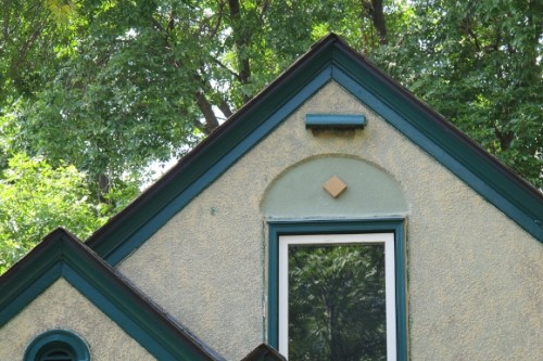 tudor roof with round arch above the window in Minneapolis. Photo by Barbara Newhall