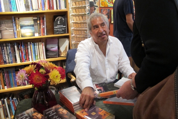 Richard Rodriguez, author of Darling, signs copies of the paperback at Sagrada bookstore, Oakland, CA/. Photo by Barbara Newhall