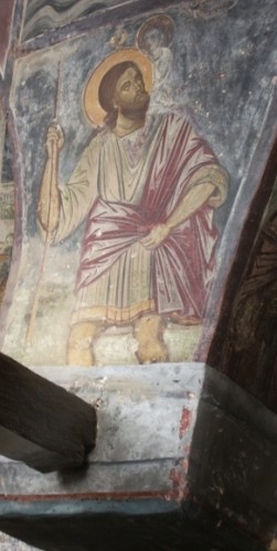 Legend has it that Christopher carried the young Jesus -- and the weight of the world -- to safety across a river. Here in a fresco on the Isle of Patmos, Greece. Photo by Barbara Newhall