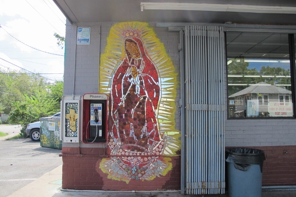 At an Austin, Texas, gas station, an image of Jesus on the cross gets a fraction of the space awarded a mosaic of his mother Mary, the Virgin of Guadalupe. Photo by Barbara Newhall