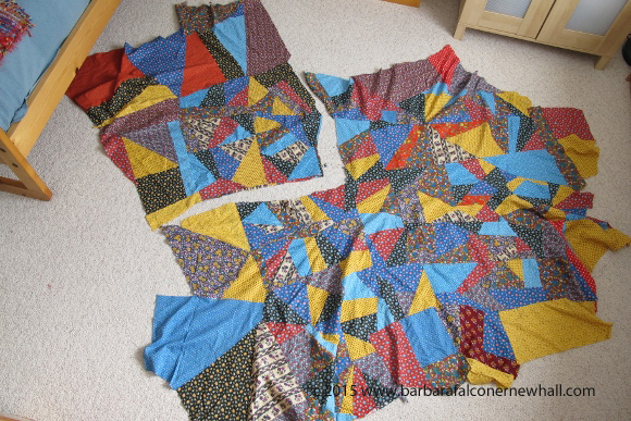 A crazy quilt top cut into pieces to make into smaller quilts. Primary colored vintage calico. Photo by Barbara Newhall
