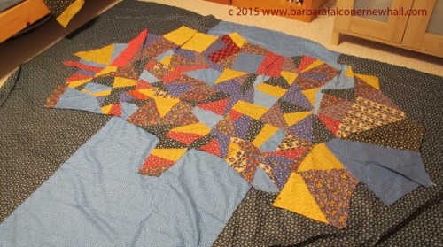 Multicolored calico piecing for a quilt top in the shape of a tree. Photo by Barbara Newhall