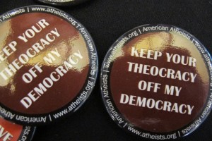 A button handed out at the 2014 Religion Newswriters Conference reads "Keep your theocracy off my democracy." Photo by Barbara Newhall