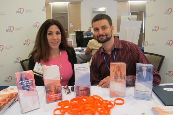 At an exhibit table at the 2014 meeting of the Religion Newswriters Association are Robyn Blumner,Executive Director of the Richard Dawkins Foundation, and Todd Stiefel of Stiefel Freethought Foundation. Photo by Barbara Newhall 